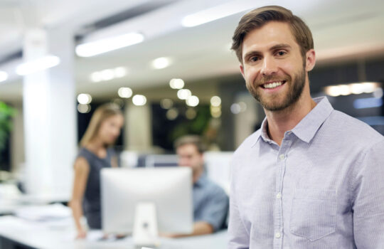 A smiling man in an office