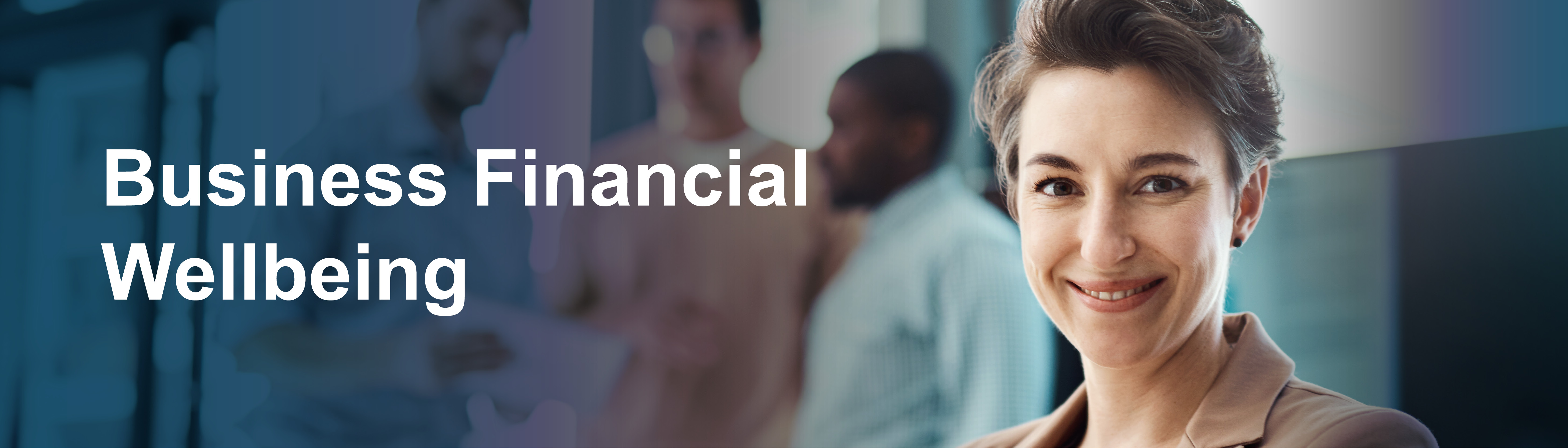 Business Financial Wellbeing. A woman smiling with her colleagues in the background.