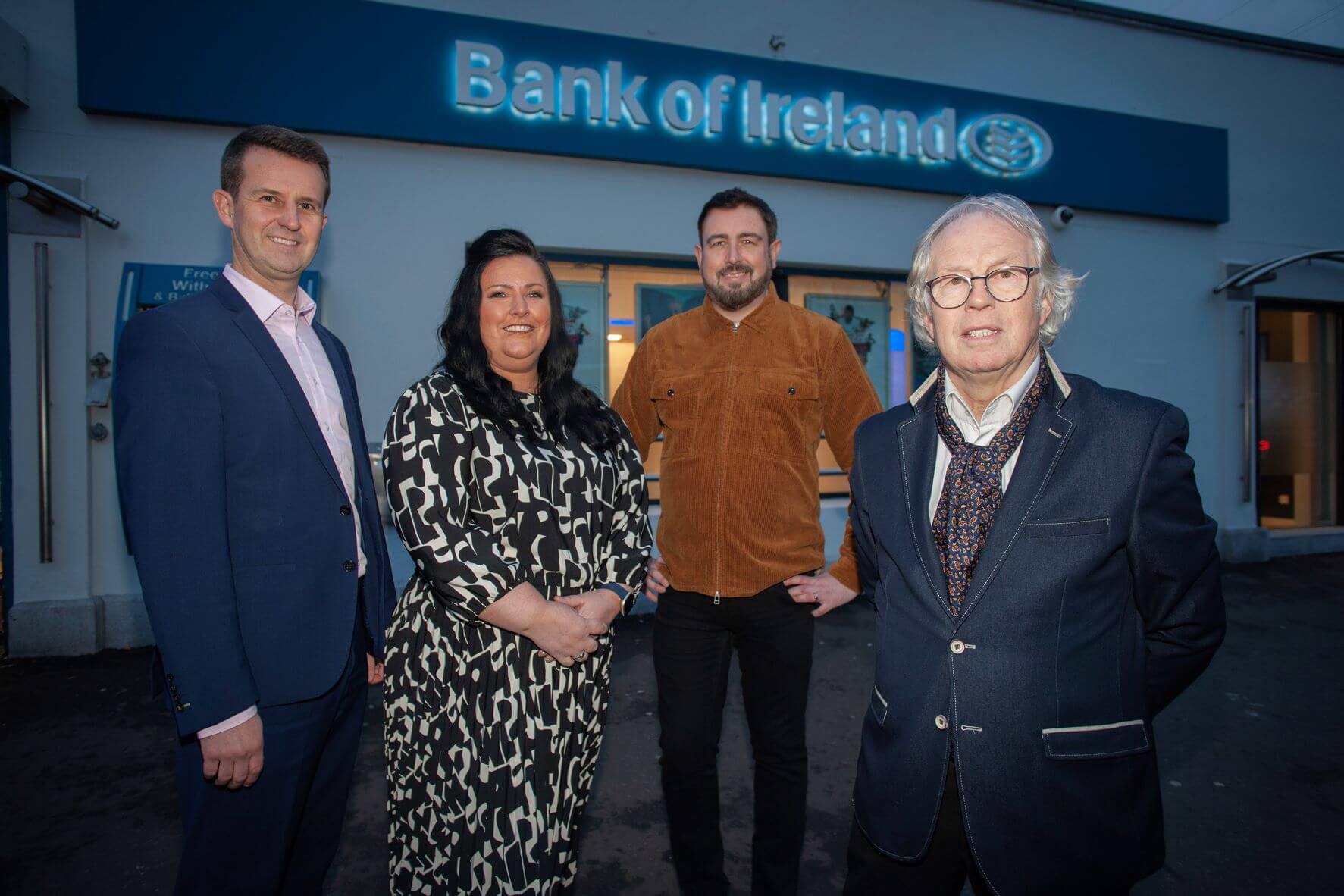 Colleen Casey, Bank of Ireland Andersonstown Branch Manager with invitees standing outside the Andersonstown Branch